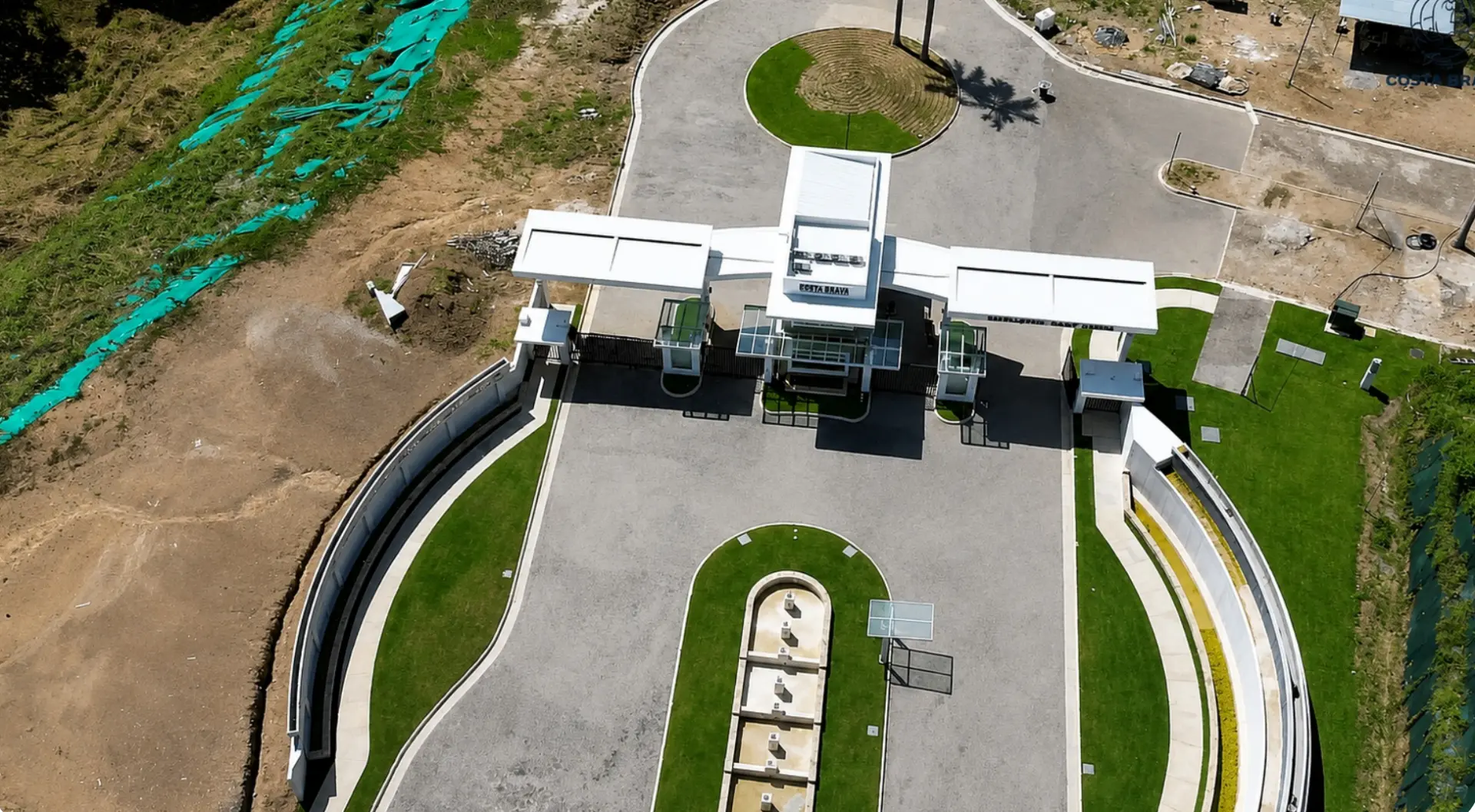 Aerial view of the branded gated entrance and finished streetscape at Costa Brava